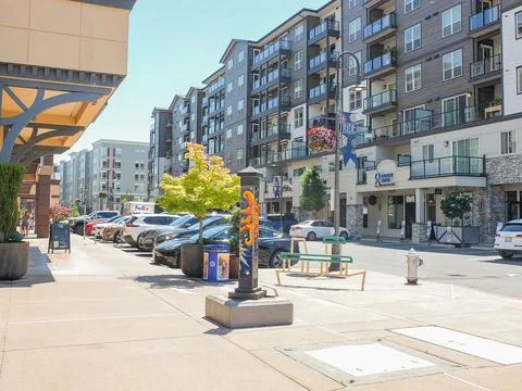 Modern street view at Point Ruston with residential apartments, parked cars.. Фото
