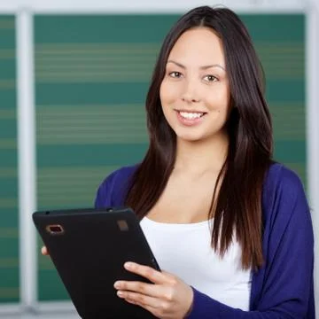 Modern student using digital pad in class room Stock Photos