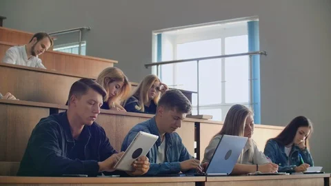 Modern students use a laptop and a tablet computer for lectures. University Vídeo Stock 116748937