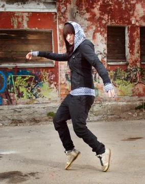 Modern style dancer posing behind Stock Photos