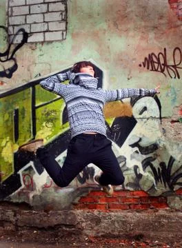 Modern style dancer posing on  grunge background Stock Photos