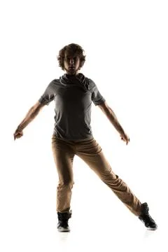 Modern style dancer posing on studio background Stock Photos