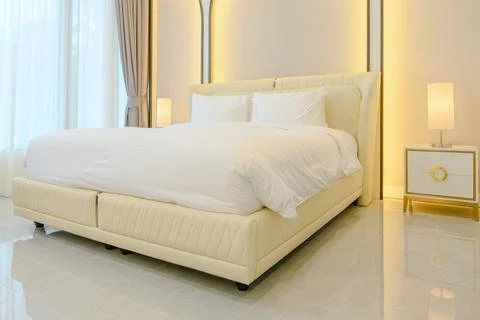 Modern style interior design of double bed  in bedroom with back light on wal Stock Photos