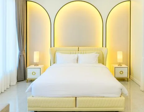 Modern style interior design of double bed  in bedroom with back light on wal Stock Photos