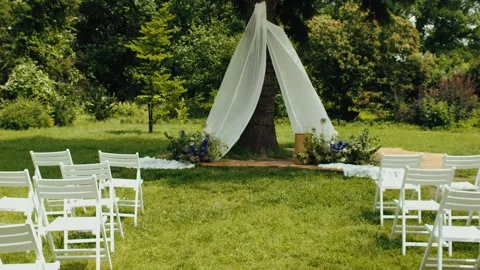 Modern stylish Wedding ceremony decorations. Wild flowers. Wide shot in slow Stock Footage 320467836