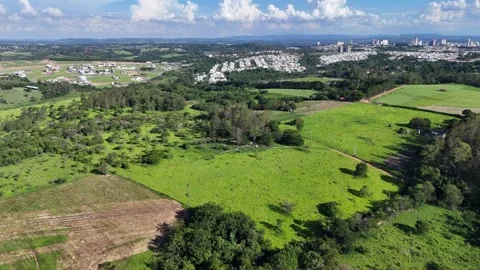 Modern Suburban Development Surrounded by Green Landscape Stock Footage 325351272