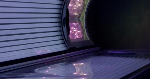 Modern Sunbed with Blue Purple Tubes and Sky Panel in Solarium, Close Up Shot Vídeo Stock 340366566