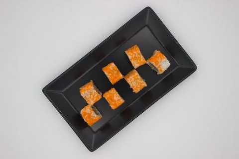 Modern Sushi Presentation on a Black Rectangular Plate Stock Photos