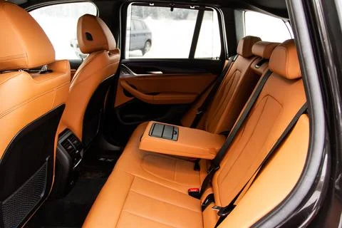 Modern SUV car inside. Leather black back passenger seats in modern luxury ca Foto stock