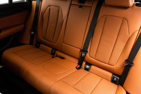 Modern SUV car inside. Leather light back passenger seats in modern luxury ca Stock Photos
