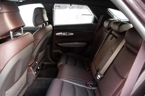 Modern SUV car inside. Leather light back passenger seats in modern luxury ca Foto stock