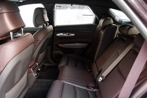 Modern SUV car inside. Leather light back passenger seats in modern luxury ca Stock-Fotos
