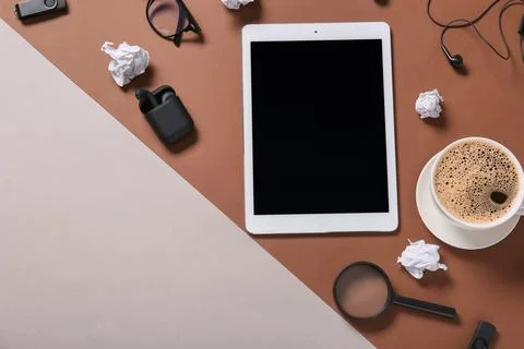 Modern tablet computer with blank screen, cup of coffee and crumpled paper on Stock Photos