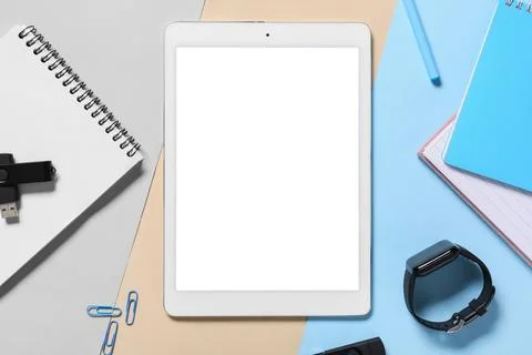 Modern tablet computer with blank screen, smartwatch and USB flash drive on c Stock Photos