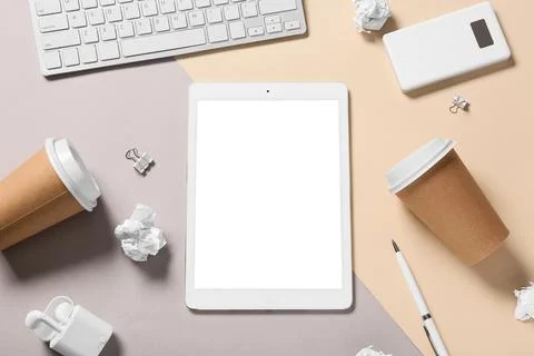 Modern tablet computer with blank screen, cup of coffee and crumpled paper on Stock Photos