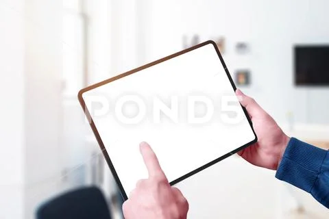 Modern tablet mockup in man hands. Horizontal position. Close-up PSD Template
