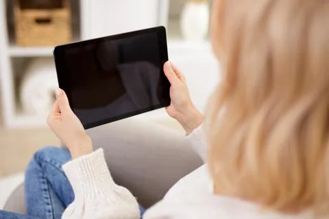 Modern tablet pc with blank screen in female hands Stock Photos
