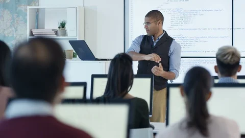 Modern teacher teaches Students of engineering in classroom Stock Footage 106682126