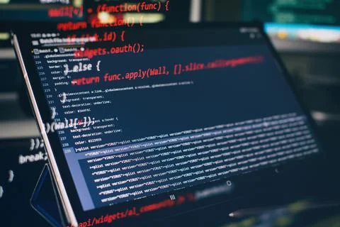 Modern tech. PHP syntax highlighted. Writing programming functions on laptop. Stock Photos