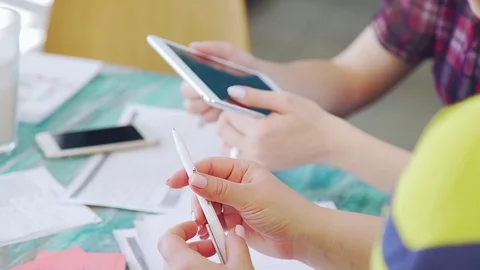 Modern technical devices on the table - a laptop, a tablet, phones. Stock Footage 78124587