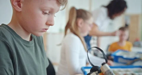 Modern technical training of children in a robotics class, where children learn Stock Footage 171776666