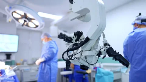 Modern technological microscope in the surgery room. Medics are getting ready Stock Footage 333336986