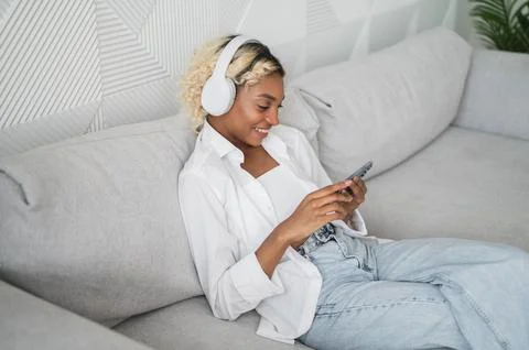 Modern technologies banner with copyspace. Happy african american looking at Stock Photos