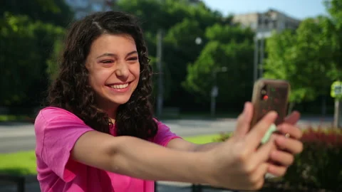 Modern technologies. Beautiful taking selfie. Cute girl talking via video link Stock-Footage 136495555