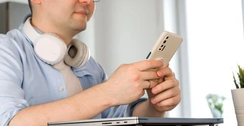 Modern technologies concept banner with unrecognizable man using smartphone Stock Photos