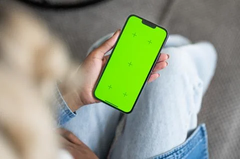 Modern technologies concept. Woman using mobile with green screen. Social media Stock Photos