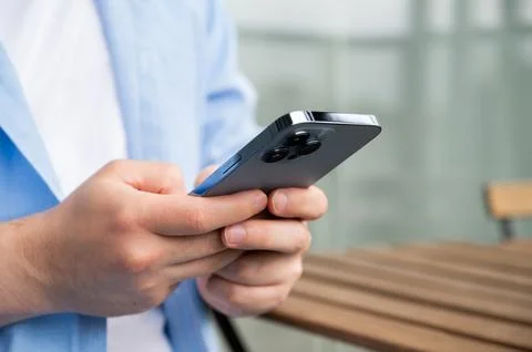Modern technologies concept with young men using phone to send messages,surf Stock Photos