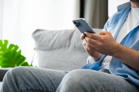 Modern technologies concept with young men using phone to send messages,surf Stock Photos