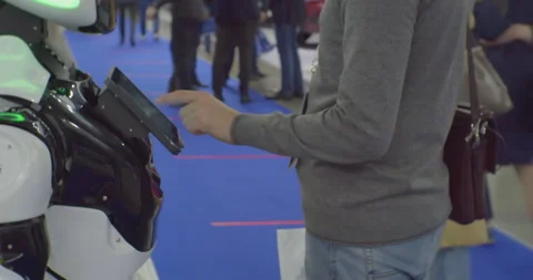 Modern technologies in everyday life.man communicate with a robot on the screen Stock Footage 162065936