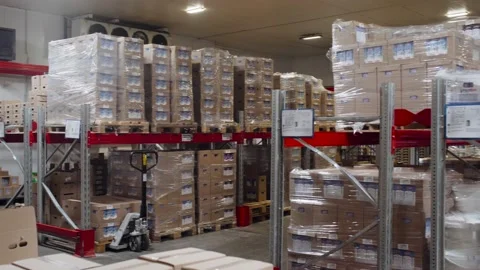Modern technologies of storage and sorting in a large warehouse cardboard boxes. Stock Footage 138824939