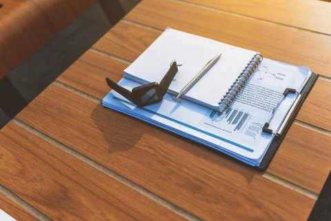 Modern technology and documents on table Stock Photos