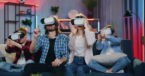 Modern technology concept where attractive happy smiling loving family sitting Stock Footage 158078301