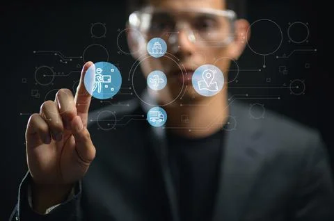 Modern Technology Interface with Transparent Digital Icons and a Male User Stock Photos
