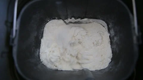 Modern technology in the kitchen. The bread maker kneads the dough. Stock Footage 90626182