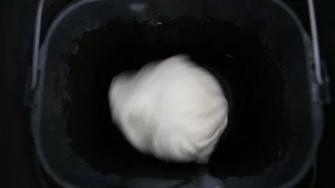 Modern technology in the kitchen. The bread maker kneads the dough. 動画素材 90861779