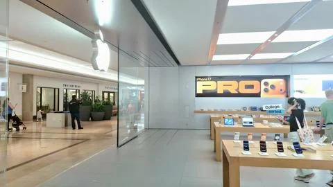 Modern technology store interior with display tables and customers Stock Photos