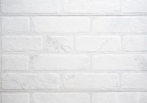 The modern texture of a white brick wall can be used as a background or a sam Stock Photos