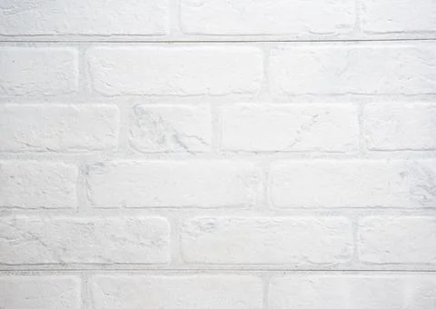 The modern texture of a white brick wall can be used as a background or a sam Stock Photos
