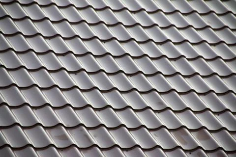 Modern tile effect PVC coated brown metal roof sheets Stock Photos