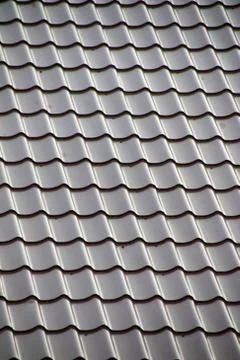 Modern tile effect PVC coated brown metal roof sheets Stock Photos