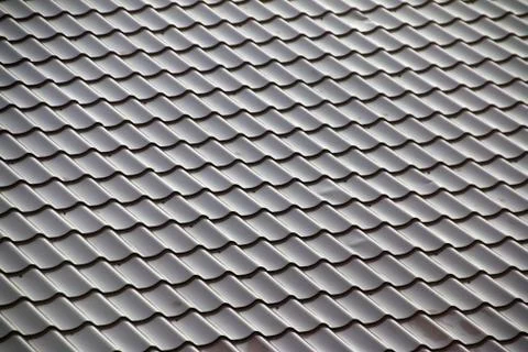 Modern tile effect PVC coated brown metal roof sheets Foto stock