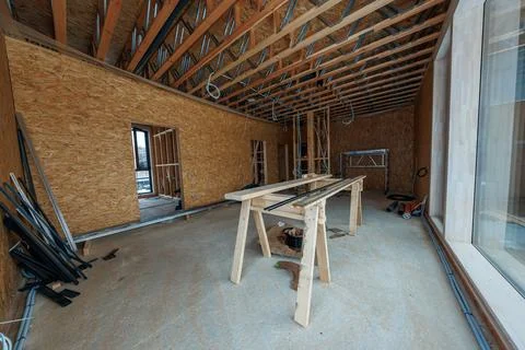 Modern timber frame house interior workshop during rough in stage Stock Photos