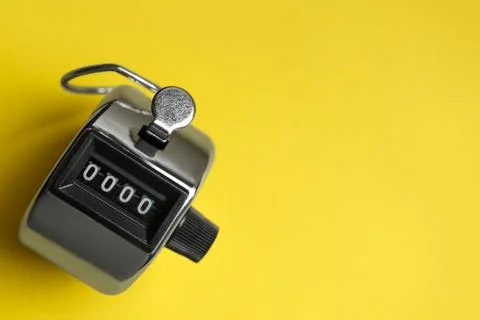 Modern timer on yellow background, top view. Space for text Foto stock