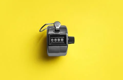 Modern timer on yellow background, top view Foto stock