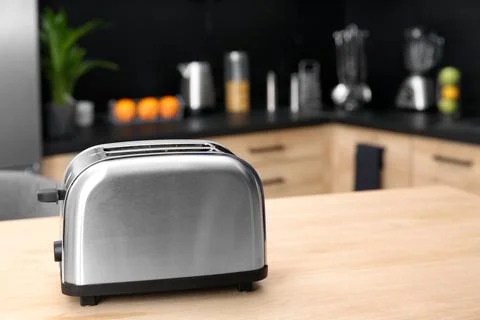 Modern toaster on table in kitchen, selective focus Stock Photos