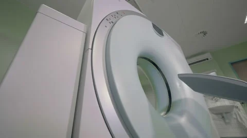 Modern tomography machine works in an empty room. CT scanner. Radiology Stock Footage 95168496